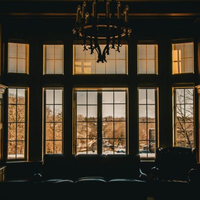 Warm interior with large windows overlooking a scenic outdoor view.